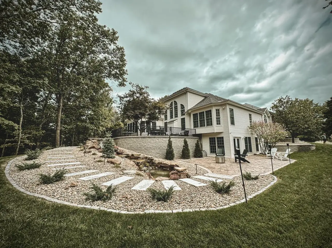 Terraced retaining wall with pond Terraced retaining wall with pond — STL Hardscape Solutions portfolio image