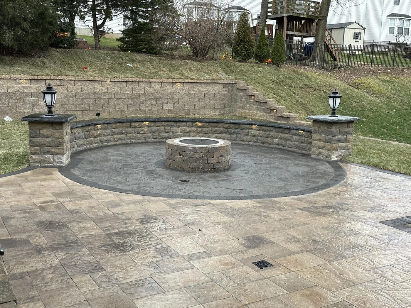 Curved Patio with Fire Pit - completed hardscape project in St. Louis