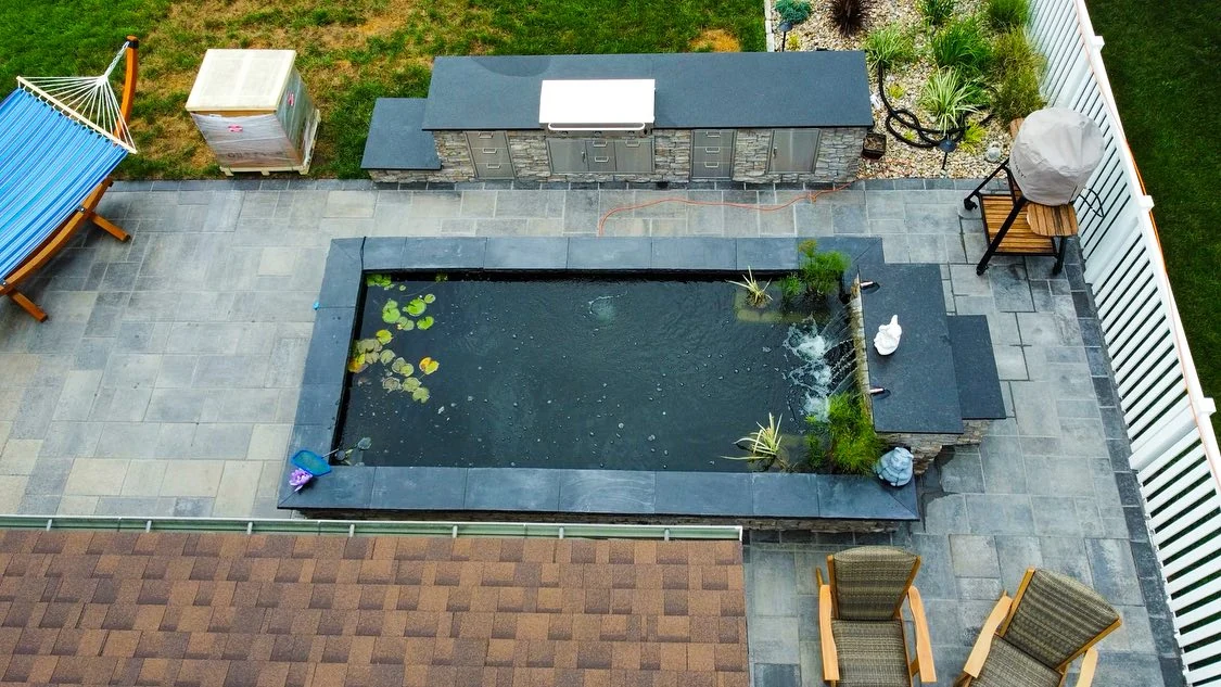 Sleek rectangular koi pond - completed hardscape project in St. Louis
