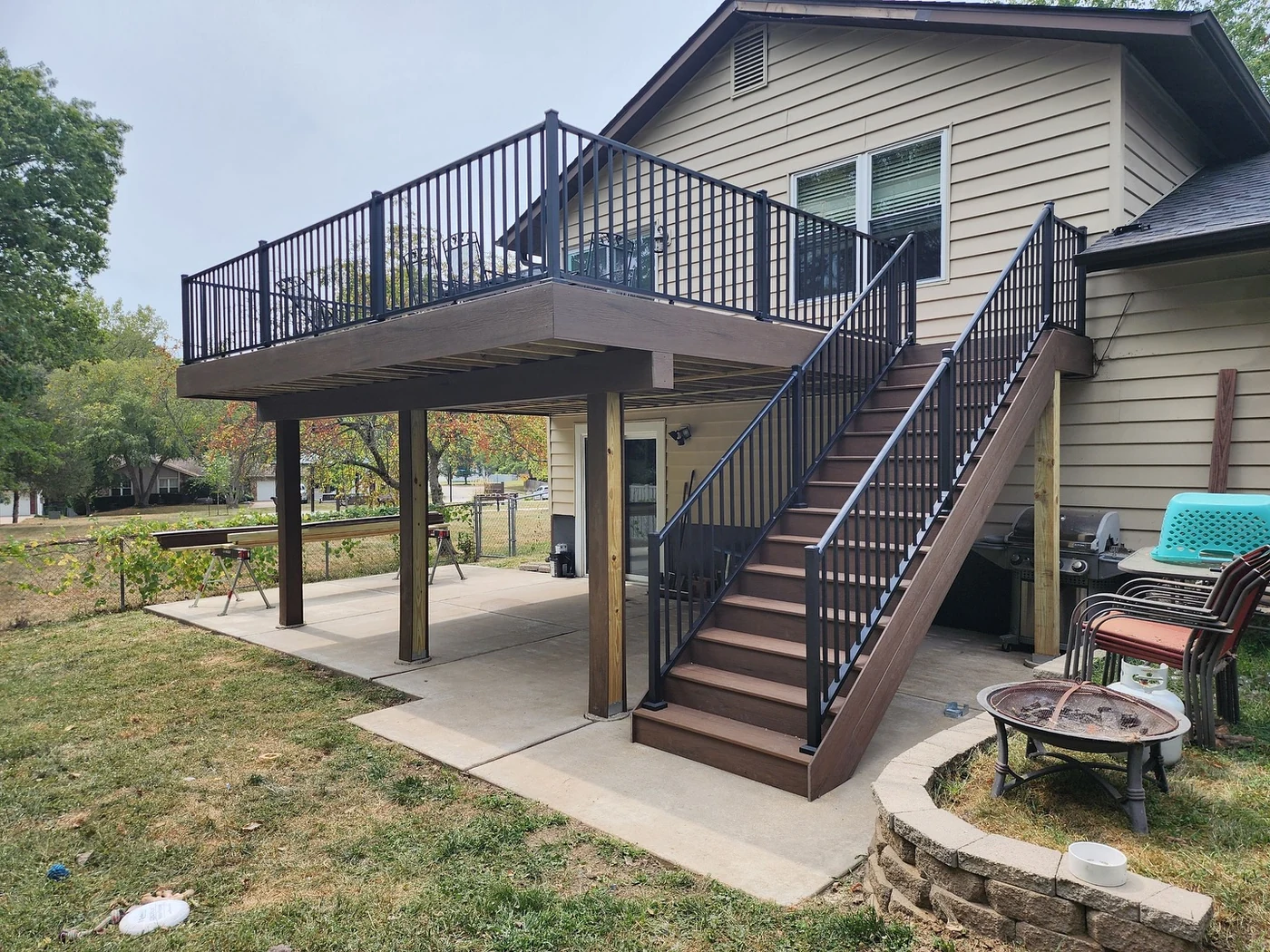 Raised composite deck with stairs Raised composite deck with stairs — STL Hardscape Solutions portfolio image