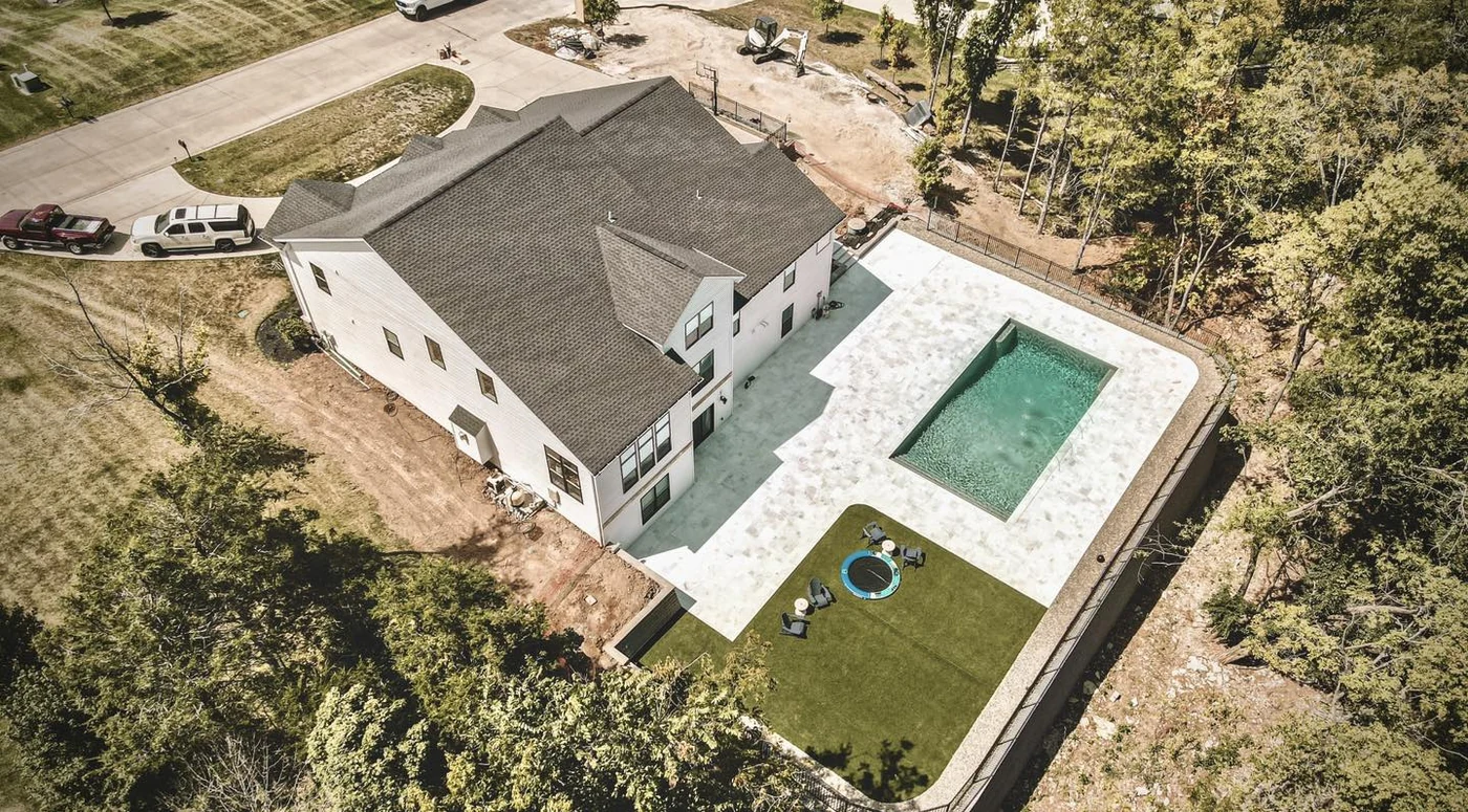 Aerial estate poolscape - completed hardscape project in St. Louis