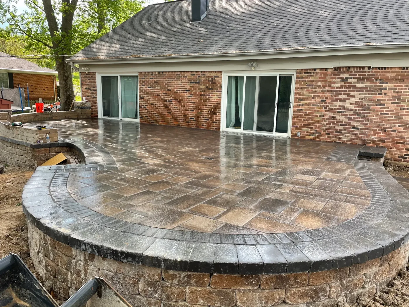 Raised paver patio with wall - completed hardscape project in St. Louis