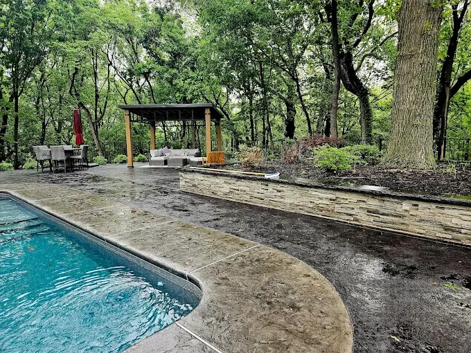 Poolside retaining wall terrace - completed hardscape project in St. Louis