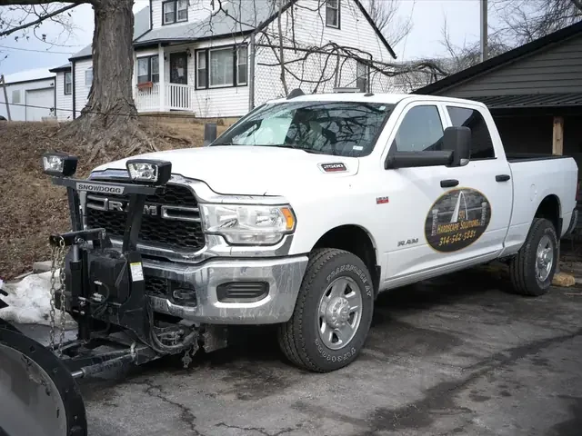 STL Hardscape Solutions snow plow truck ready for commercial snow removal in Greater St. Louis